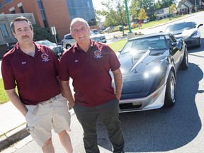 Gary McGuinness, left, and Moe Dupuis, right, members of the Corvette Club of Windsor, stand with their Corvettes outside Windsor Regional Hospital Met campus after making a $5,500 donation to support paediatric oncology on Tuesday, Sept. 28, 2021.