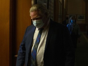 CP-Web. Ontario Premier Doug Ford makes his way back to his office after a news conference at the Queens Park Legislature in Toronto on Wednesday, April 7, 2021. The Province announced further lockdown restrictions in their latest effort to combat the spread of the COVID-19 virus.