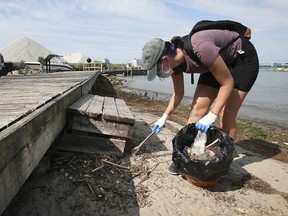 Hannah Schaefer participates in the Detroit River cleanup event at the McKee Park in Windsor on Saturday, Sept. 11, 2021.
