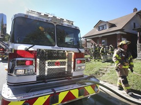 Windsor firefighters are shown at the scene of a house fire in the 1000 block of Dougall Avenue on Friday, September 24, 2021. The fire broke out shortly after 11 a.m. and no injuries were reported.