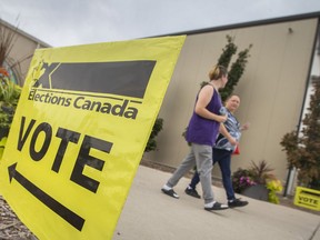 People exit the WFCU Centre after voting in the riding of Windsor-Tecumseh on Election Day, on Monday, Sept. 20, 2021.