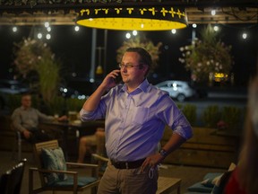 Irek Kusmierczyk, Liberal candidate for Windsor-Tecumseh, speaks on the phone after arriving at Parks & Rec Gastropub and Sports Bar to greet his supporters on election night, on Monday, Sept. 20, 2021.