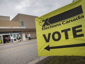 WINDSOR, ONTARIO:. SEPTEMBER 20, 2021 - Voters line up outside the WFCU Centre as they wait to vote in the riding of Windsor-Tecumseh on Election Day, on Monday, Sept. 20, 2021.