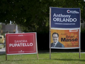 Election signs from local candidates in Windsor West are seen at the corner of Dominion Boulevard and Northwood Street on Thursday, September 9, 2021.