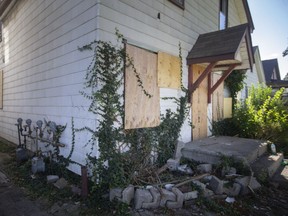 Boarded up windows are seen at the scene of an early morning fire on the 700 block of Windsor Avenue, on Thursday, Sept. 30, 2021.