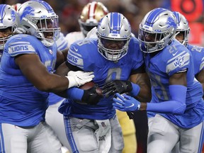 Detroit Lions outside linebacker Jamie Collins is mobbed by teammates after recovering a fumble during the first quarter against the San Francisco 49ers at Ford Field.