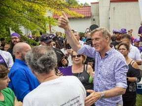 People's Party of Canada leader Maxime Bernier mingles with some of the more than 1000 supporters that attended a campaign rally at Springbank Gardens in London, Ont. on Wednesday September 15, 2021.