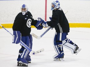 Toronto Maple Leafs goalie tandem of Petr Mrazek (left) and Jack Campbell switch off the ice during a scrimmage at their practice facility in Etobicoke on Sept. 15, 2021.