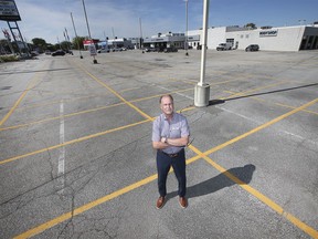 Mickey Pierre, a salesman at Gus Revenberg Chevrolet Buick GMC in Windsor, is shown on a virtually empty sales lot on Thursday, September 30, 2021.