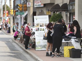 The Olde Riverside BIA and Pillette Villa BIA held a large garage sale on Saturday, Sept. 4, 2021. People peruse items along Wyandotte Street East.