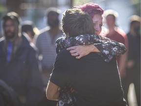 "A very hard year." Jennifer Rupert, who struggles with drug addiction, shares an emotional hug with a friend after sharing her experience during A Night to Remember outside the Downtown Mission on Monday, Sept. 27,  2021. The event was held for those impacted by drug overdoses to come together and heal.