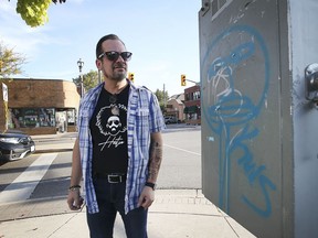 Mike Osborne, coordinator for the Ottawa Street BIA, checks out graffiti along Ottawa Street on Thursday, Sept. 30, 2021.