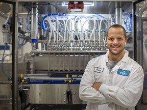 Gregg Battersby, president and founder of Peak Processing Solutions, is pictured with the beverage canning line at their facility in Oldcastle, on Wednesday, September 1, 2021.