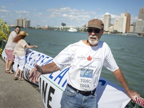 Doug Hayes, chair of the Windsor Essex Chapter of the Council of Canadians, is joined by a small group of activists as they hold a small rally to protest the Line 5 pipeline, along the waterfront on Wednesday, September 1, 2021.
