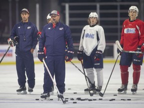 Windsor Spitfires' head coach, Marc Savard, and associate coach Jerrod Smith, left, hope to get back to practice on Tuesday and return to play on Wednesday, but OHL plans are still unclear.