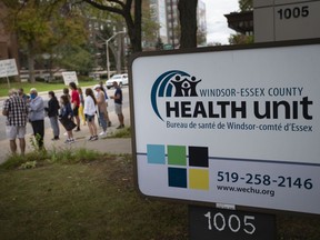 Parents, coaches and students opposed to the local health unit's postponement of extracurricular activities, protest outside the Windsor-Essex County Health Unit on Ouellette Avenue, on Thursday, Sept. 9, 2021.