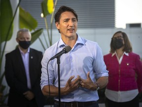 Liberal Leader Justin Trudeau speaks during a campaign stop in Windsor on Friday, Sept. 17, 2021. Behind him are University of Windsor president, Robert Gordon, and Liberal candidate for Essex, Audrey Festeryga. Election day is Monday.