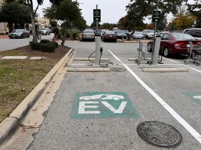 FILE PHOTO: An electric vehicle (EV) fast charging station is seen in the parking lot of a Whole Foods Market in Austin, Texas, U.S., December 14, 2016.