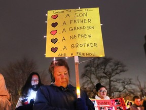 A sign at a vigil for Windsor murder victims held in November 2018.