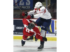 Centre Ethan Martin, left, and defenceman Dylan Robinson collide during a game on Saturday during the training camp for the Windsor Spitfires.