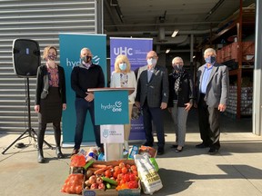 Hydro One announced a $150,000 donation to Feed Ontario, the provincial organization representing Ontario food banks, on Wednesday, Oct. 20, 2021. The announcement was made at the UHC-Hub of Opportunities in Windsor, where the organization operates a food bank. UHC officials said they has seen the number of people accessing its food bank almost double in the last year. Pictured (from left) Rachel Dixon, director of development for Feed Ontario; Jason Fitzsimmons,  chief corporate affairs officer for Hydro One; June Muir, CEO of UHC-Hub of Opportunities; Essex County Warden Gary McNamara; Leamington Mayor Hilda MacDonald; Lakeshore Mayor Tom Bain.