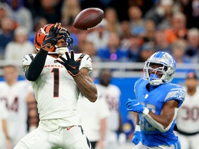 Ja'Marr Chase of the Cincinnati Bengals complets a pass for a first down against the Detroit Lions during the third quarter at Ford Field on October 17, 2021 in Detroit, Michigan.