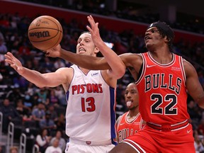 Kelly Olynyk of the Detroit Pistons battles for the ball against Alize Johnson of the Chicago Bulls during the first half at Little Caesars Arena on October 20, 2021 in Detroit, Michigan.