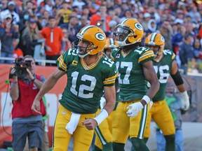 Green Bay Packers quarterback Aaron Rodgers (12) celebrates scoring a touchdown during the second half against the Chicago Bears at Soldier Field.