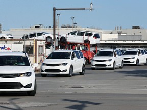 Chrysler Pacificas are loaded onto trucks at the Windsor Assembly Plant in October, 2021.