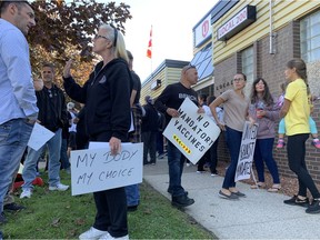 Chrysler workers protest the vaccination mandate outside the Unifor building on Turner Road on Oct. 18, 2021.