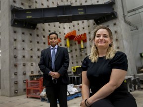 Fiona Coughlin, executive director and CEO at Habitat for Humanity Windsor-Essex, and Sreekanta Das, left, professor of Civil and Environmental Engineering at the University of Windsor, are pictured in front of a heavy structural testing facility where 3d printed walls and components will be tested, at the Ed Lumley Centre for Engineering, on Friday, Oct. 15, 2021.