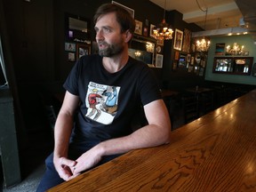 Danforth Ave. bar owner Russell Piffer of the The Edmund Burke responds to the announcement made at Queens Park on Friday to open establishments to full capacity. QR Codes for vaccination are still mandated on Friday October 22, 2021.