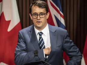 Ontario Labour Minister Monte McNaughton takes to the podium during a news conference in Toronto on Wednesday, April 28, 2021.