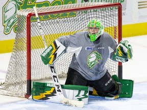 London Knights goalie Mathias Onuska follows a puck that ricocheted off the shaft of his stick during team practice at Budweiser Gardens. (Derek Ruttan/The London Free Press)