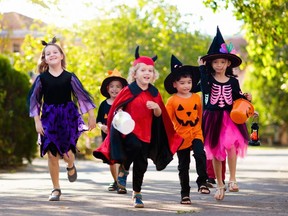 Kids trick or treat. Halloween fun for children.