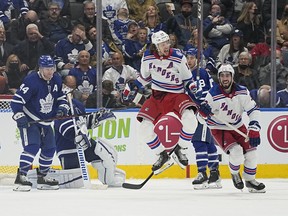 New York Rangers forward Artemi Panarin celebrates his winning goal in overtime as Maple Leafs defenceman Morgan Rielly looks on at Scotiabank Arena on Monday, Oct. 18, 2021.