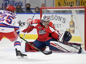 Kitchener Rangers' forward Declan McDonnell is stopped by Windsor Spitfires' goalie Xavier Medina in the first period of Friday's game. David Bebee/Waterloo Record