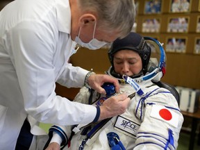 Space flight participant Yusaku Maezawa undergoes a spacesuit fit-check ahead of the expedition to the International Space Station in the Moscow region, Russia October 20, 2021.