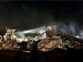 LaSalle Fire Service crews extinguish a barn fire on Short Snake Line shortly before 1 a.m. on Thursday, Oct. 21, 2021.