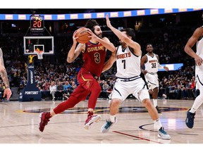 Cleveland Cavaliers guard Ricky Rubio drives to the net against Denver Nuggets guard Facundo Campazzo in the third quarter at Ball Arena.