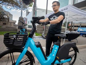 Salikh Tursunov, a Bird Canada representative, demonstrates how a Bird Bike works. Photographed in downtown Windsor on October 17, 2021.