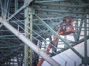 Construction work continues on the Ambassador Bridge on Wednesday, Oct. 20, 2021. While construction of the Gordie Howe International Bridge keeps pushing towards opening for traffic in three years, it appears the Ambassador Bridge company’s proposed twin span has hit roadblocks with seemingly no action by its owners to advance the project.