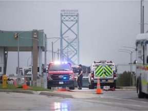 Windsor police investigate a possible explosive at the inspections area of the Ambassador Bridge, on Monday, Oct. 4, 2021.  Traffic flowing into Canada has been halted.