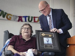 Longtime radio personality and community fundraiser Cam Gardiner, left, received the key to the city from Windsor Mayor Drew Dilkens on Friday, October 1, 2021 to mark a lifetime of achievement and contributions to the region.