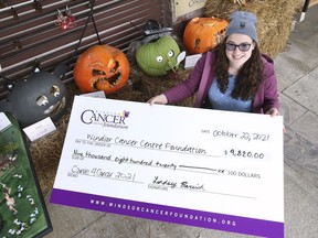 Lindsey Bareich poses with a ceremonial cheque at a press conference on Friday, October 22, 2021 for the Windsor Cancer Centre Foundation's Carve 4 Cancer fundraiser.