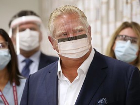 Ontario Premier Doug Ford tours the Devonshire Mall Vaccination Centre in Windsor on Monday, Oct. 18, 2021.