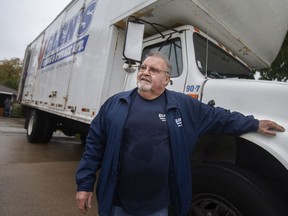 Glen Cook, owner of Glen's Moving Ltd., is pictured next to his moving truck after packing up items at a home on Jefferson Avenue, on Friday, Oct. 28, 2021.