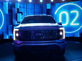 The all-electric Ford F-150 Lightning truck during an augmented reality presentation at the Motor Bella Auto Show in Pontiac, Michigan, U.S., on Tuesday, Sept. 21, 2021.