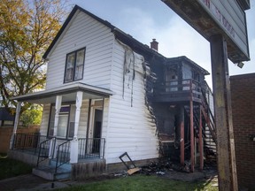 Significant fire damage can be seen on the side of a duplex at 969 Wyandotte St. West after an early morning fire, on Saturday, Oct. 9, 2021.