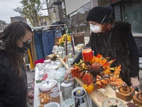 Kathleen Pistor sells vintage items at the Downtown Windsor Business Improvement Association's first-ever fall flea market at the Pelissier Street parking garage, on Sunday, Oct. 24, 2021.